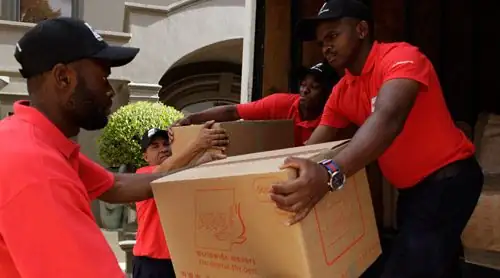 DOKI Movers team carrying boxes